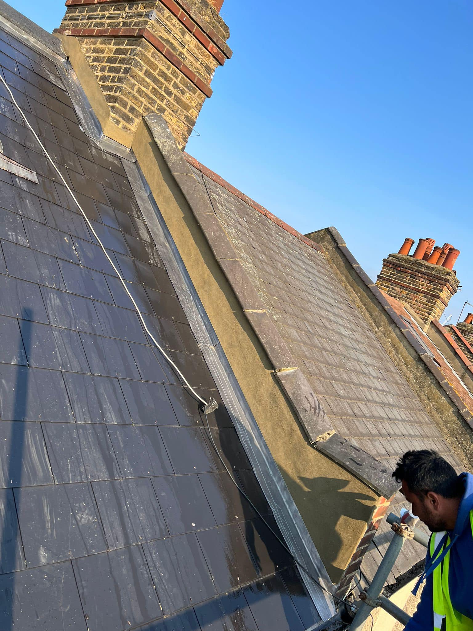 Professional roofers working on a property in London - KS Roof Master