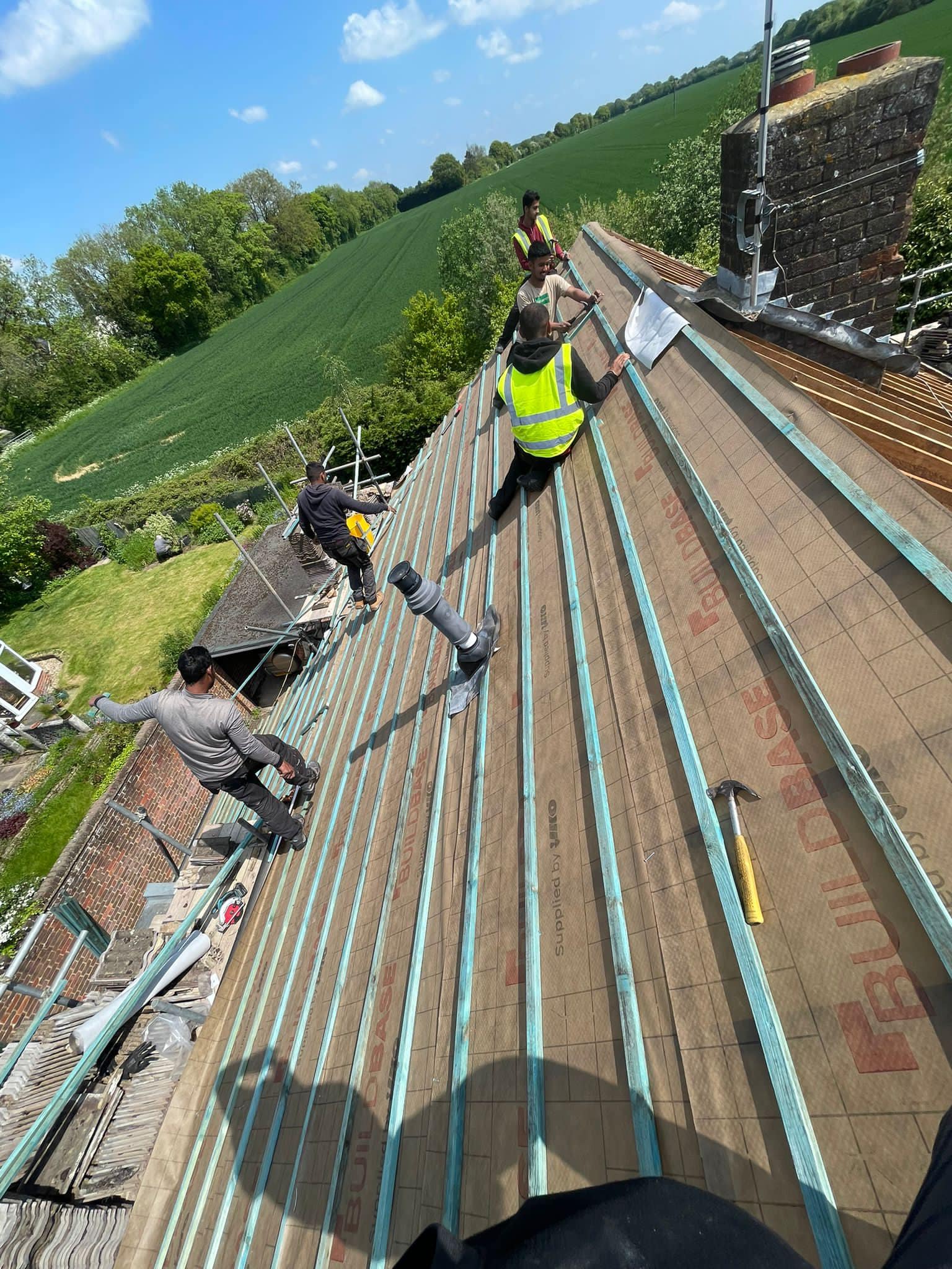 Professional roofers working on a property in London - KS Roof Master