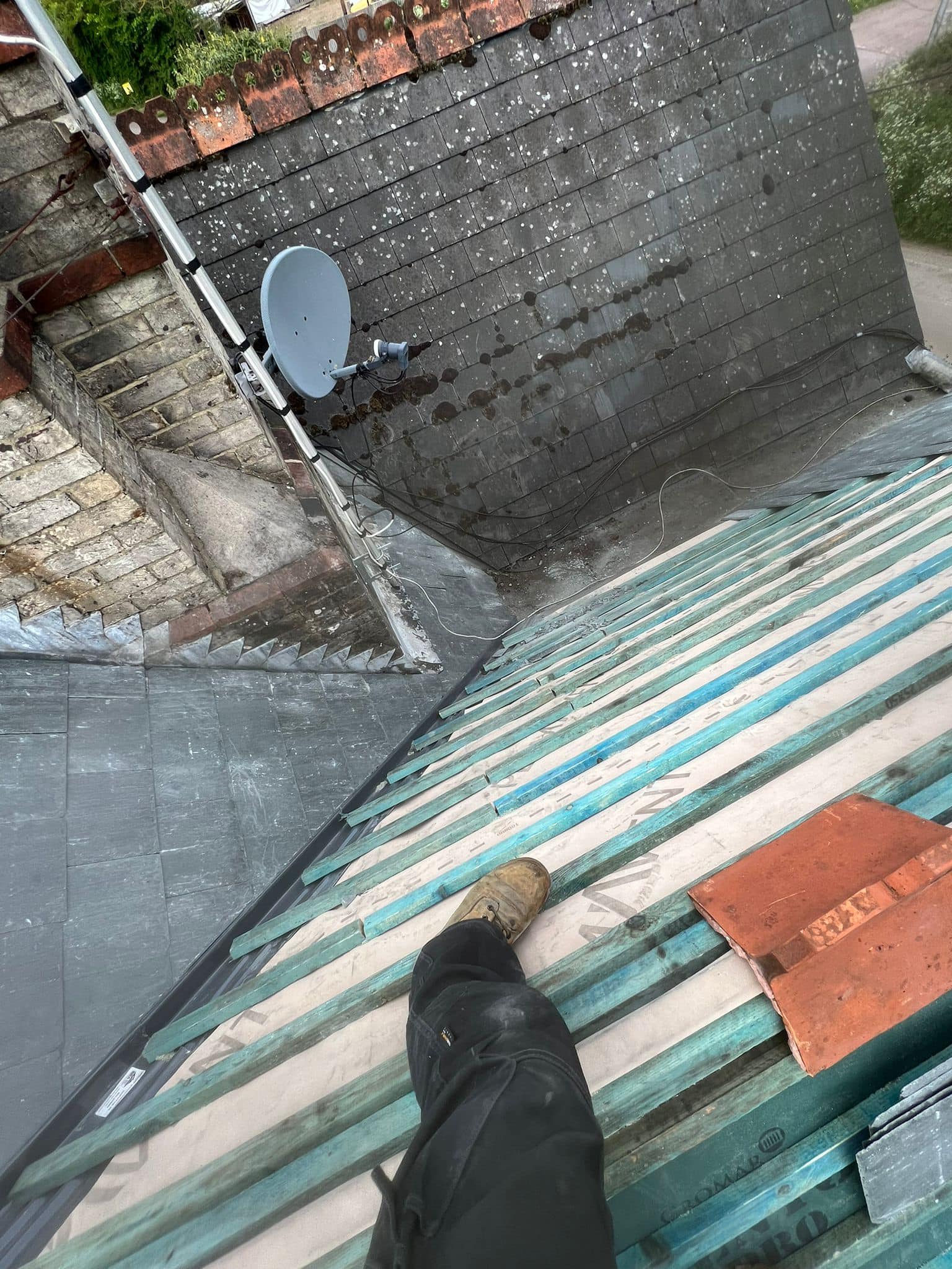 Professional roofers working on a property in London - KS Roof Master