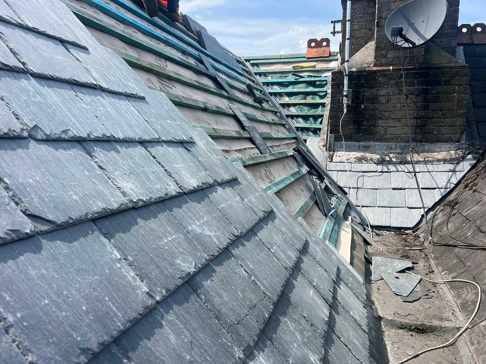 Professional roofers working on a property in London - KS Roof Master