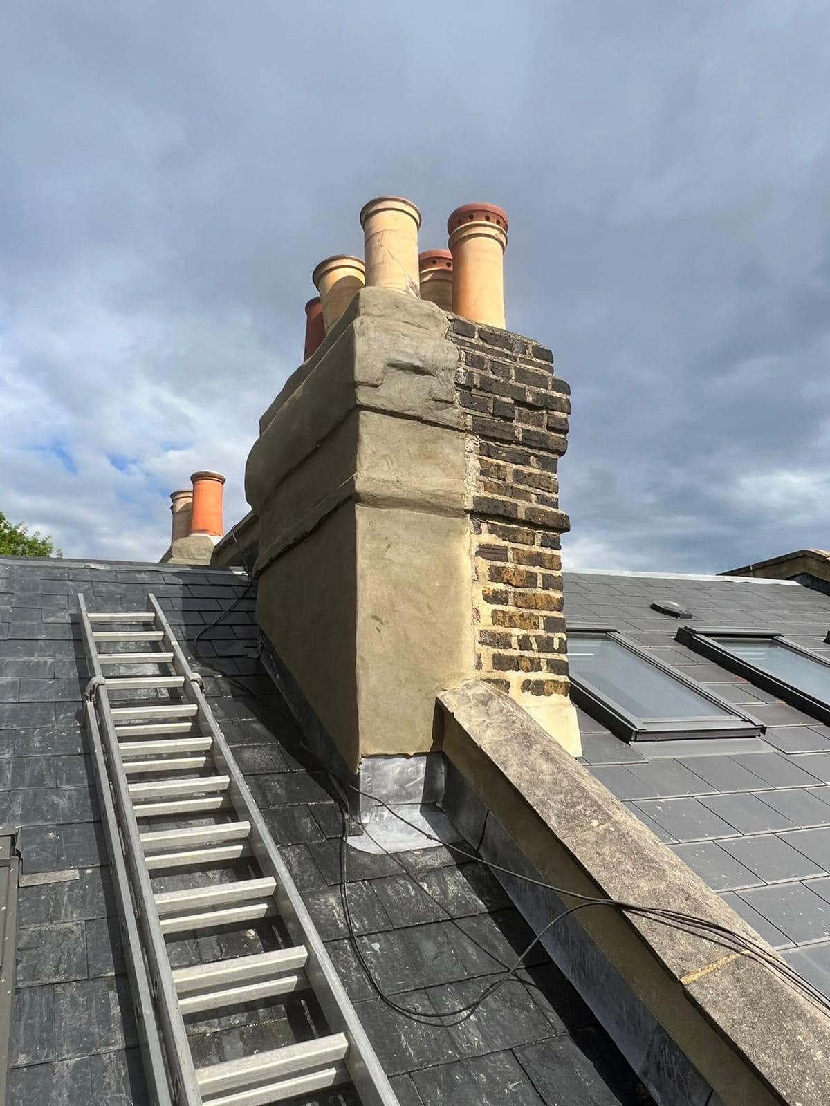 Professional roofers working on a property in London - KS Roof Master