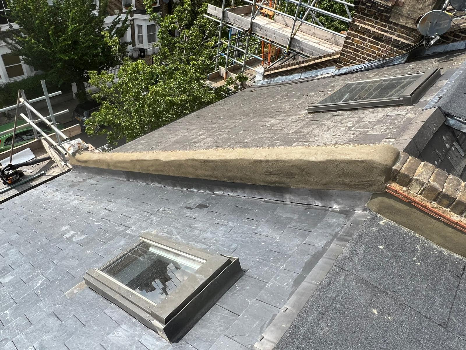 Professional roofers working on a property in London - KS Roof Master