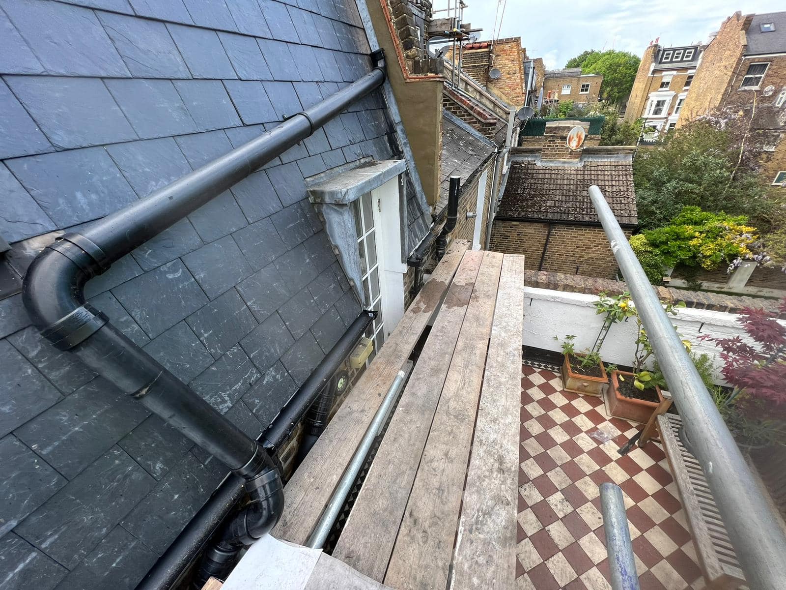 Professional roofers working on a property in London - KS Roof Master