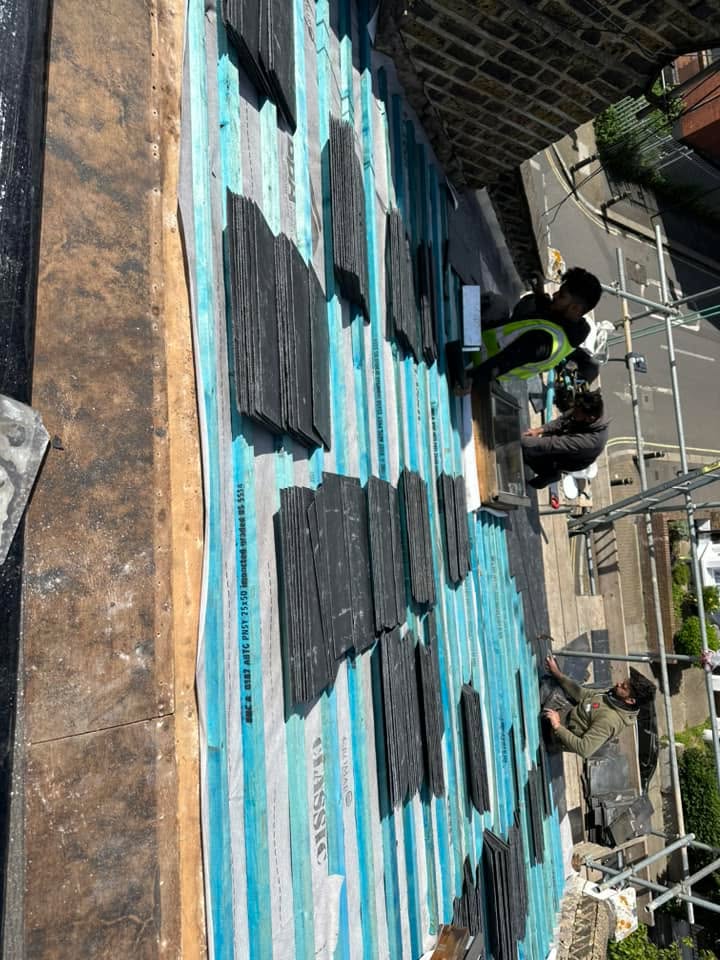 Professional roofers working on a property in London - KS Roof Master