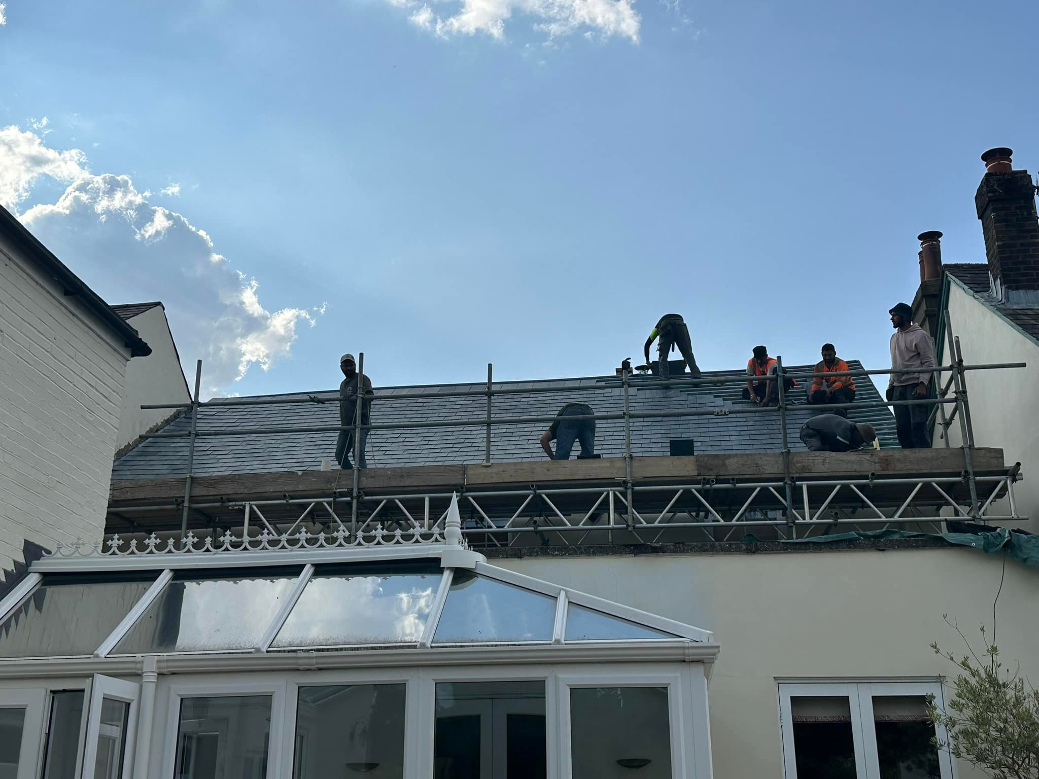 Professional roofers working on a property in London - KS Roof Master