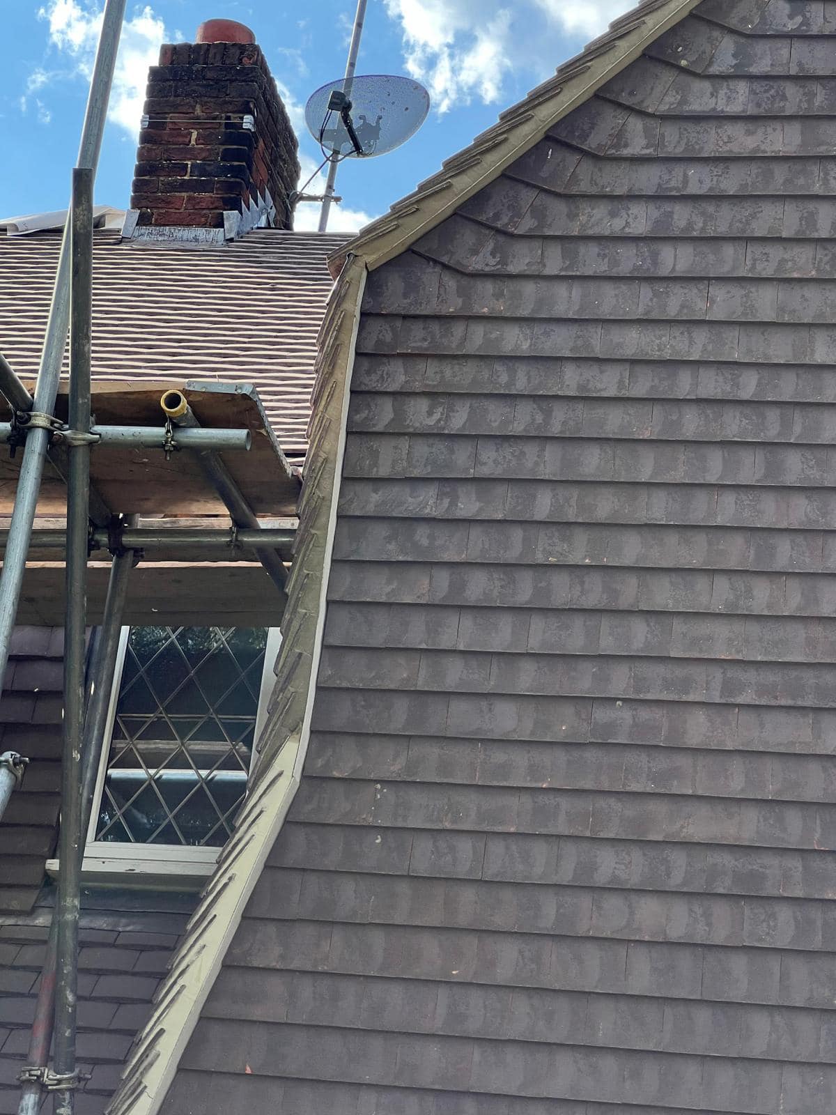 Professional roofers working on a property in London - KS Roof Master