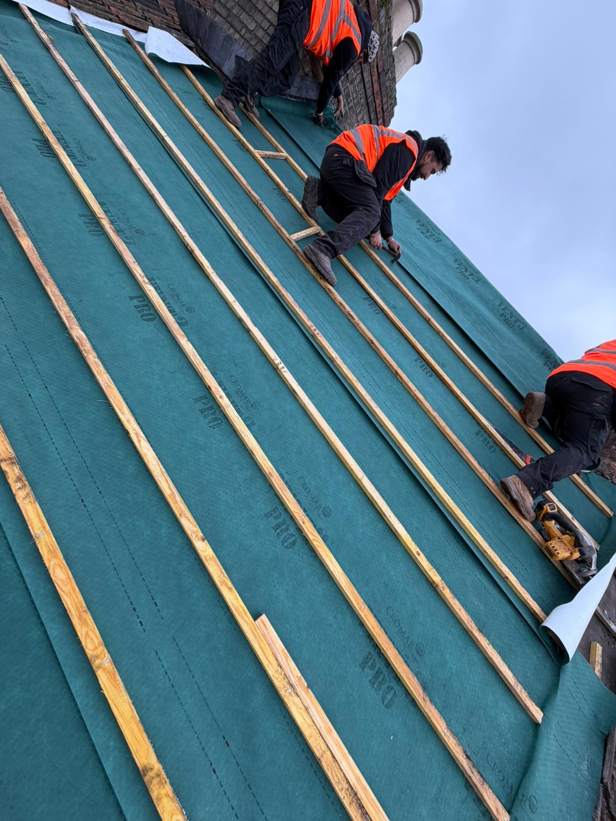 Professional roofers working on a property in London - KS Roof Master