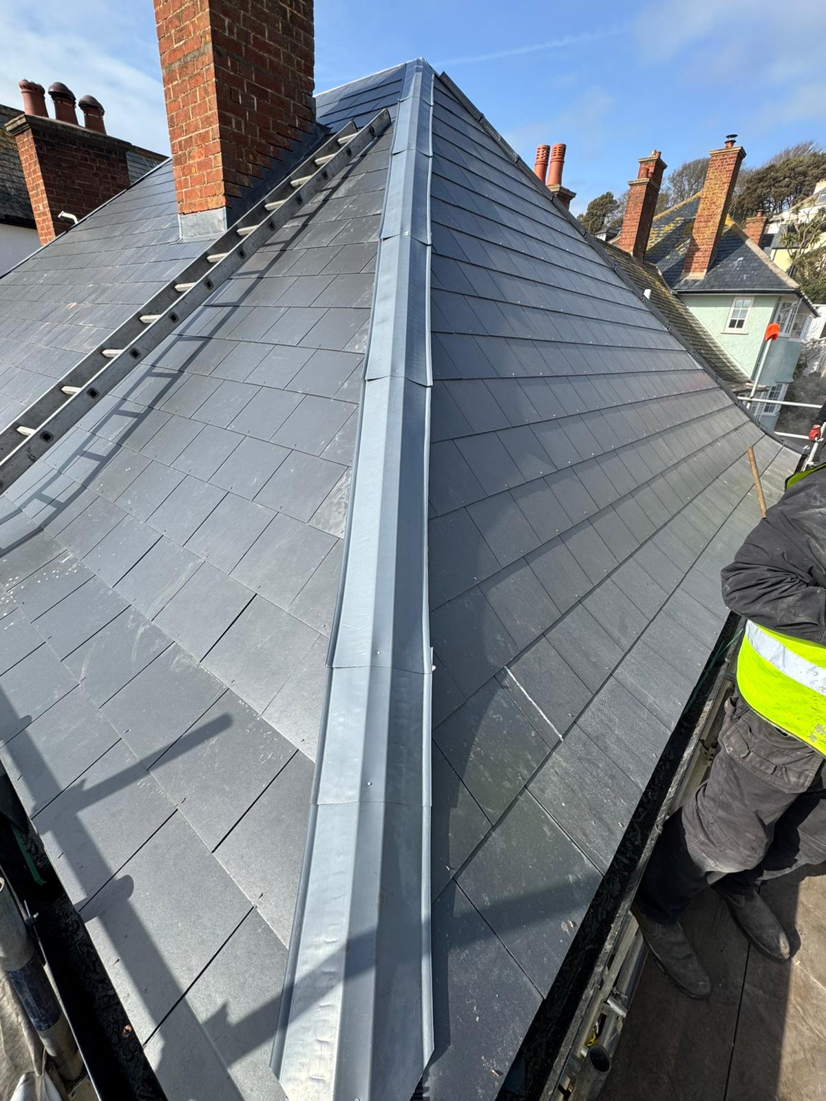 Professional roofers working on a property in London - KS Roof Master